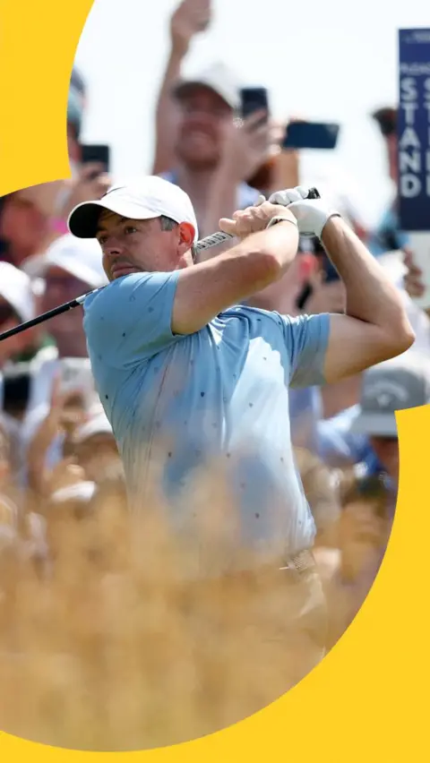 Rory McIlroy mid-swing in a blue shirt and white cap at the Scottish Open.