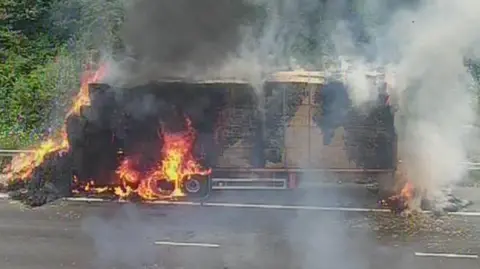 National Highways The lorry on fire
