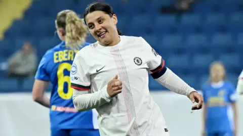 Sam Kerr wheels away in celebration