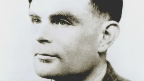 Science Photo Library A black-and-white photo of Alan Turing, looking to the right of the camera