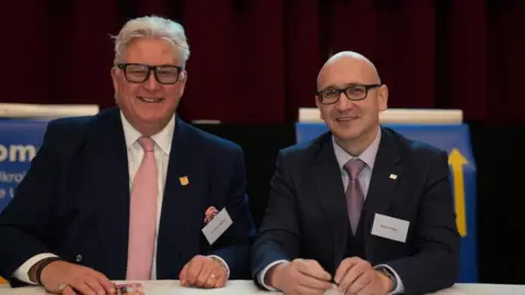 John Fairhall/BBC Kevin Bentley, the leader of Essex County Council with Edouard Fesko, Ukraine Chargé d’Affaires