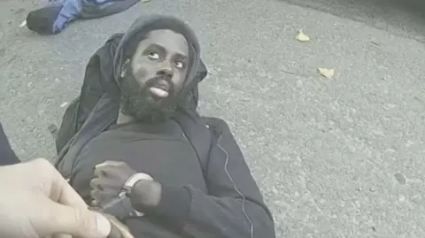 Nottinghamshire Police Police bodycam footage of Valdo Calocane being placed in handcuffs on the day of the Nottingham attacks on 13 June 2023 after he had fatally stabbed three people and tried to kill three others. 