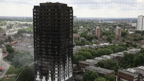 Getty Images The Grenfell Tower in London shown burnt out after the fire in 2017