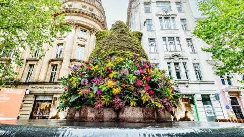 The Girls Aloud floral tribute garden in St Ann's Square in the 2024 Manchester Flower Festival