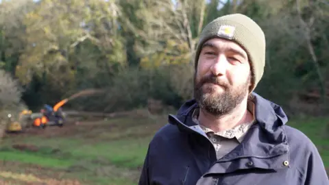 Jon Parkes - a man in a beard and beanie hat