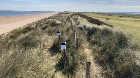 Earlham Institute Two air samplers standing back from the Norfolk coast