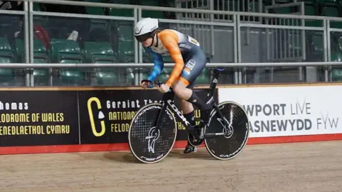 Supplied A man in lycra on a track bike going around a velodrome in Newport, Wales.