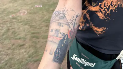 Black Sabbath tattoo on a man's forearm