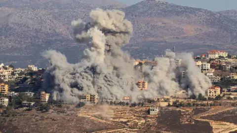 Getty Images Smoke billows during an Israeli airstrike on the the southern Lebanese village of Khiam near the border with Israel on October 3, 2024