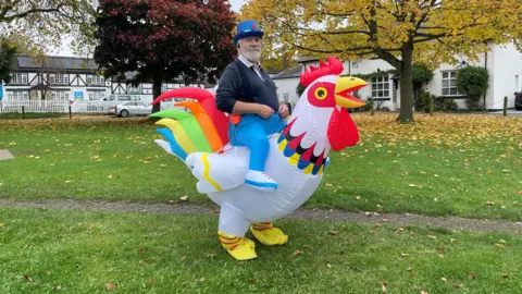 Neil dressed as a rooster