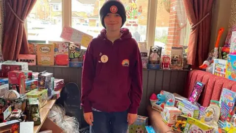 BBC Isaac in a room full of gifts