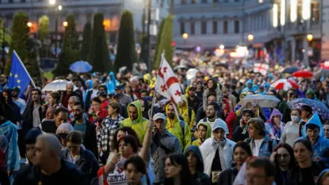 Protesters march in Tbilisi on Saturday