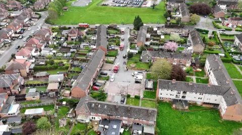Nottinghamshire Fire and Rescue Service An aerial view of Tevery Close and Copeland Avenue in Stapleford, Nottinghamshire where a number of fire service vehicles and police are at the scene following a gas leak. 