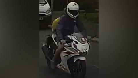 A person on a motorcycle