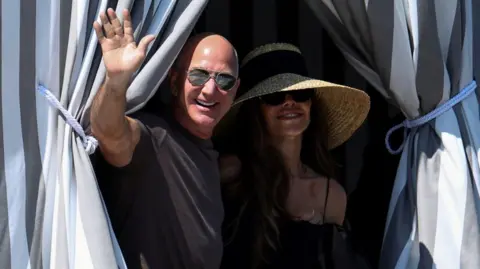 Jeff Bezos and Lauren Sanchez pictured on Saturday on the final day of their wedding celebrations in Venice