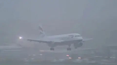 Flight landing in foggy weather at Heathrow 