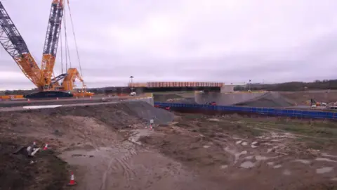 Leicestershire County Council The bridge structure in place with a crane to the left