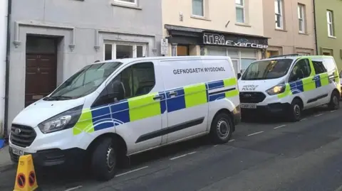 Police vans outside Upper Market Street in Haverfordwest on 10 January, 2024