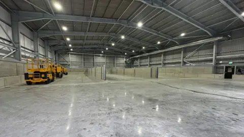 BBC Interior of a large shed, which has been specially built to hold solid and liquid waste