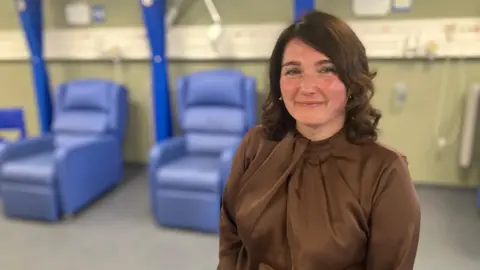Jenni Twinn in front of recliners