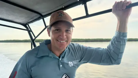 Kelly Ewin's job is to capture and remove crocodiles from Darwin Harbour