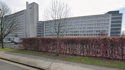A large white office block from street view.
