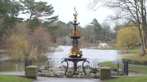 Gary Rogers / Geograph An ornate fountain by a lake in Hesketh Park