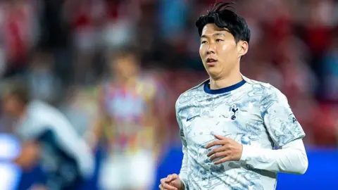 Getty Images Son Heung-Min of Tottenham Hotspur warms up on the pitch before a friendly match with Arsenal in July 2025 in Hong Kong