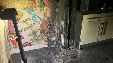 Derbyshire Fire and Rescue Service Fire damage on a wall