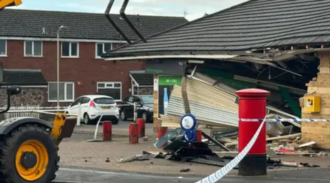 Leicester Media Online Building damaged with police cordon and industrial machine left to behind.