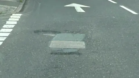 Mark Ritchie A pothole repair in Tennyson Road, in Ipswich