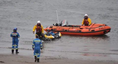 Stranraer RNLI Kayaks on the shore