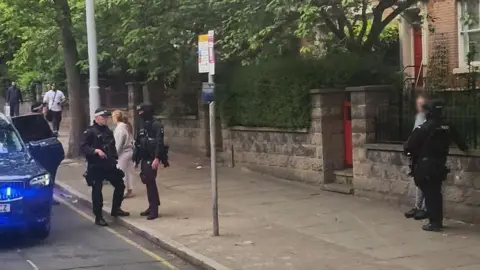Police stopping person on Mansfield Road in Nottingham