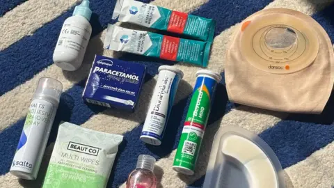 Lucy Smith-Butler Lucy's essential stoma bag kit with spare stome, tape, creams and sprays.