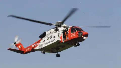 An Irish Coast Guard helicopter in the sky 