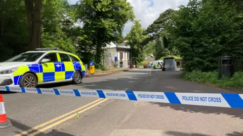 BBC Police cars at the suspension bridge