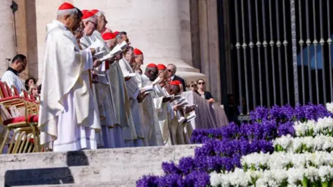 Reuters Clergy members attend the Easter Mass in St. Peter's Square at the Vatican