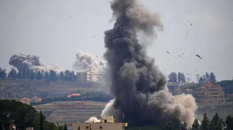 Smoke billows from an Israeli air strike in the Nabatieh area, southern Lebanon (2 June)