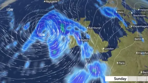 A weather graphic for wind on Sunday with blue swirls over parts of the UK, including Northern Ireland. The map also includes parts of Europe with capital cities' names above each place e.g 'Dublin', 'Edinburgh' and 'London'.