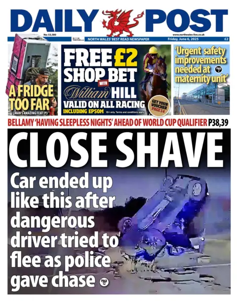 Daily Post Front page of the Daily Post with the splash headline "close shave" and a picture of a upside down car after a crash. Above it is a coupon for William Hill betting shop, a picture of a man climbing a hill with a fridge on his back along with the strap line "a fridge to far", and a picture of a building with the headline "Urgent safety improvements needed at maternity unit".