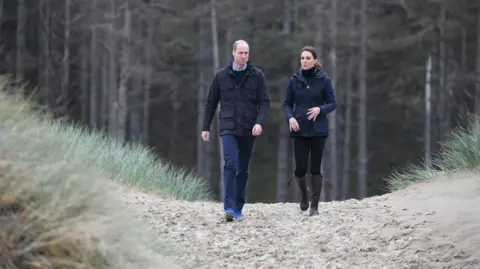 Getty Images Prince of Wales and Catherine, Princess of Wales on a stroll on Newborough beach