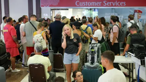 Emirates passengers stranded at I Gusti Ngurah Rai International Airport in Bali, Indonesia