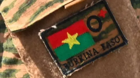 A Burkina Faso army uniform, typical of a senior officer.