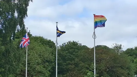 Mel Metcalf A union jack, flag of County Durham and a Pride rainbow flag all flying.