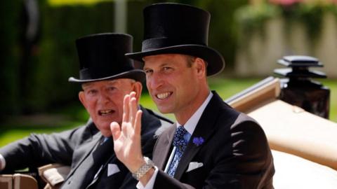 The Prince of Wales seen arriving at Royal Ascot by carriage wearing a top hat and tails. Alongside him is the Earl of Halifax.