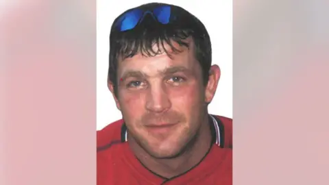 GMP/PA Wire Headshot of a male with sunglasses on his head, wearing red top 