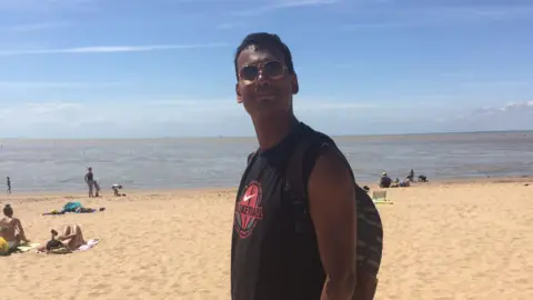 Family handout Guillaume Hoareau pictured on a beach