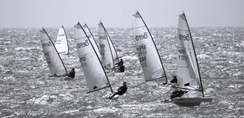 Graham Woollven Aero dinghies head towards the camera on choppy seas