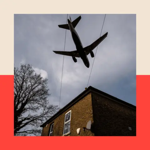 Getty Images Aircraft comes in to land at Heathrow airport over nearby houses