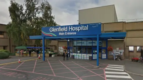 The exterior of an entrance to Glenfield Hospital.